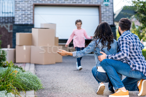 girl running to hug parents Stock photo © LightFieldStudios