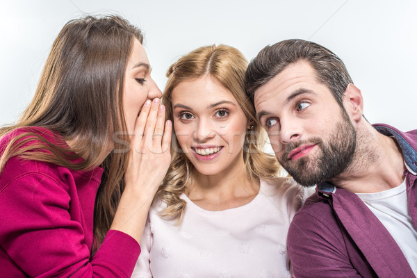 Fiatal barátok suttog fehér nők háttér Stock fotó © LightFieldStudios