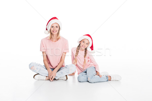 mother and daughter in santa hats Stock photo © LightFieldStudios