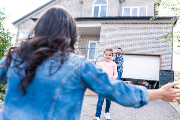 daughter running to mother for hug Stock photo © LightFieldStudios