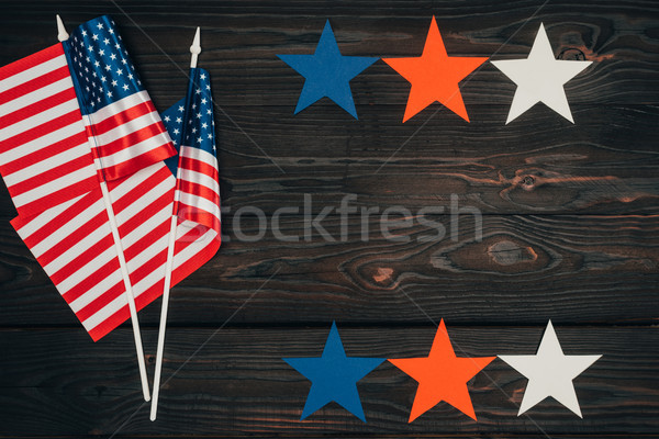 top view of arranged american flags and stars on wooden surface, presidents day celebration concept Stock photo © LightFieldStudios