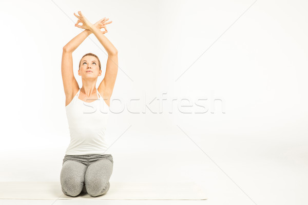 Woman practicing yoga Stock photo © LightFieldStudios