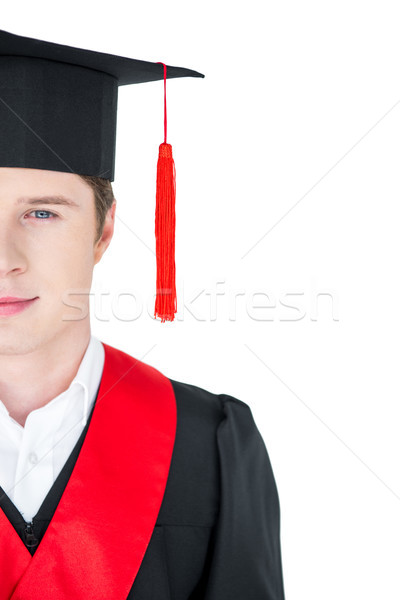 Cropped shot of happy young man in mortarboard looking at camera Stock photo © LightFieldStudios
