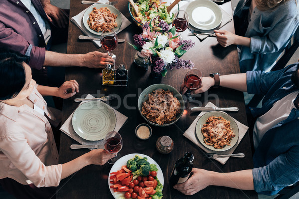 Amici cena shot di mezza età insieme tavola Foto d'archivio © LightFieldStudios