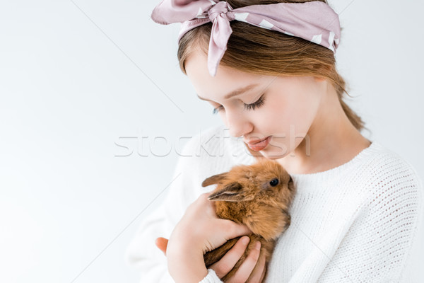 close-up view of cute child holding adorable furry rabbit isolated on white  Stock photo © LightFieldStudios