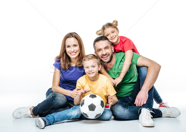 Happy family with soccer ball Stock photo © LightFieldStudios