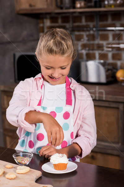 kid making cupcake Stock photo © LightFieldStudios