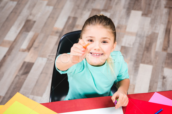 Stock photo: Schoolchild pointing with pencil