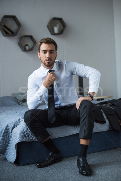 businessman straightening tie  Stock photo © LightFieldStudios