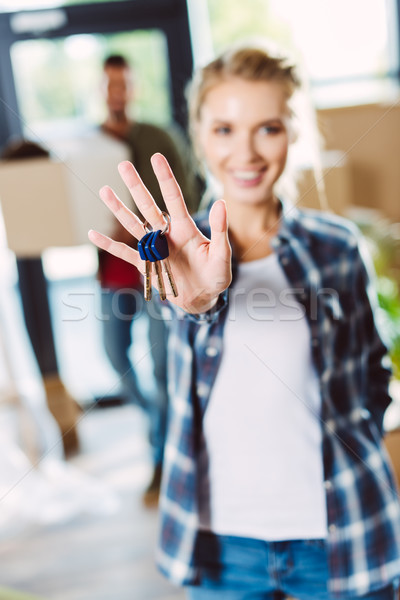 woman holding keys Stock photo © LightFieldStudios