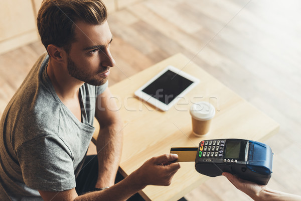 man paying with credit card Stock photo © LightFieldStudios
