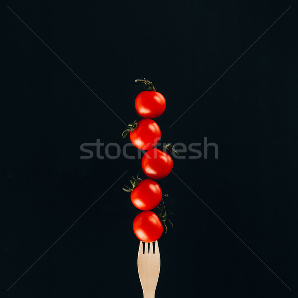 Ver tomates cereja garfo isolado preto Foto stock © LightFieldStudios