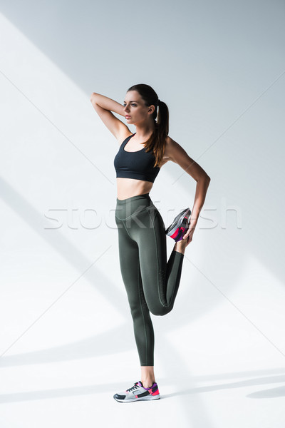 woman stretching before workout Stock photo © LightFieldStudios