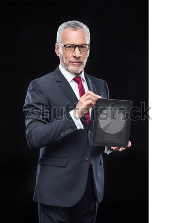 Businessman holding digital tablet Stock photo © LightFieldStudios