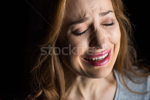 Fiatal nő sír közelkép portré fiatal gyönyörű nő Stock fotó © LightFieldStudios