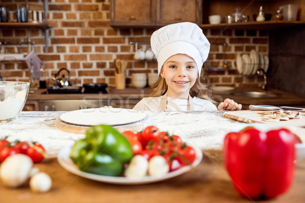 portrait of little girl with pizza dough and various ingredients  Stock photo © LightFieldStudios