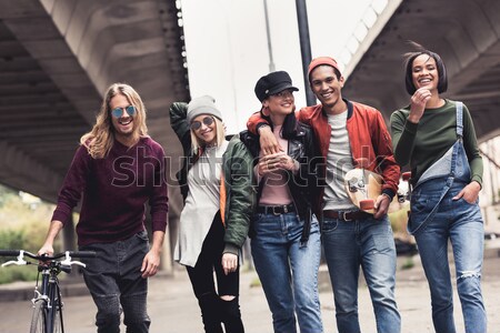 friends spending time together outdoors Stock photo © LightFieldStudios