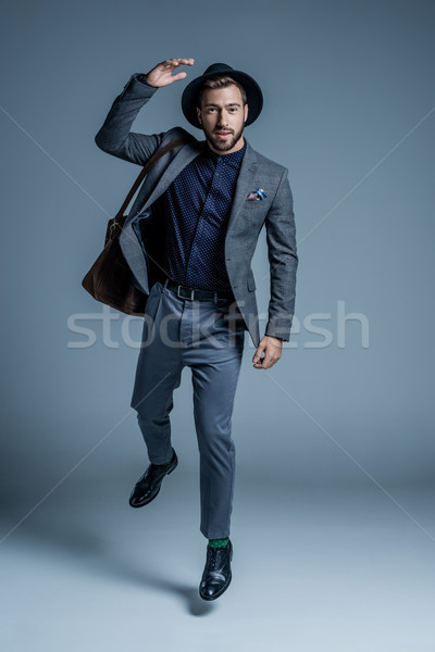 Stock photo: man in suit and hat walking
