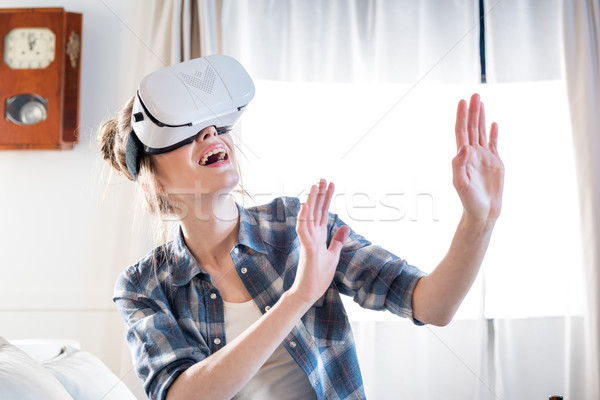 Kadın sanal gerçeklik kulaklık genç heyecanlı Stok fotoğraf © LightFieldStudios