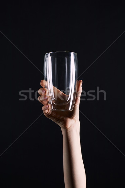 cropped shot of woman holding empty glass isolated on black Stock photo © LightFieldStudios