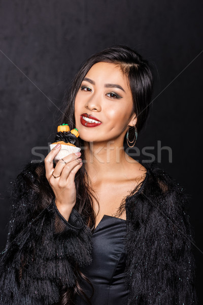 woman holding cupcake Stock photo © LightFieldStudios