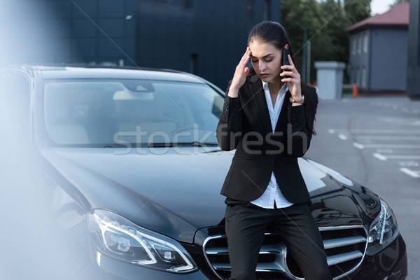 Problémás üzletasszony beszél telefon fiatal ül Stock fotó © LightFieldStudios