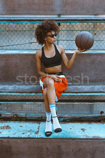 woman in sportswear and heels with basketball Stock photo © LightFieldStudios