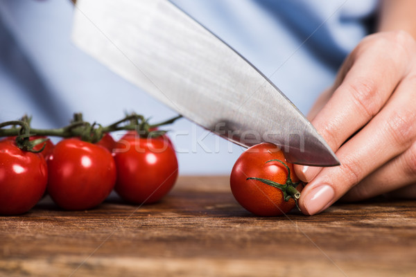 женщину помидоры черри мнение ножом Сток-фото © LightFieldStudios