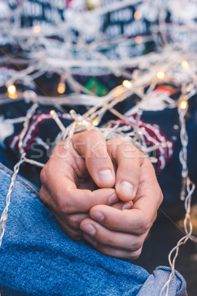 man tied up with christmas garland Stock photo © LightFieldStudios