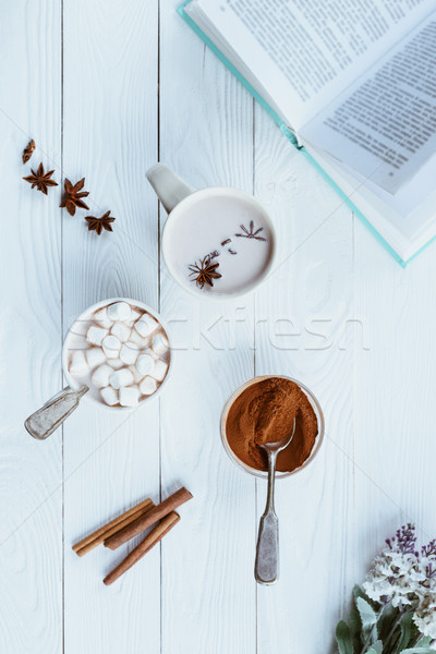 cups of aromatic cacao and book Stock photo © LightFieldStudios
