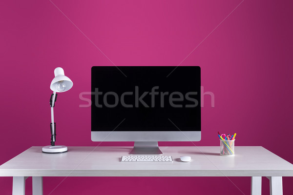 desktop computer with blank screen, keyboard, computer mouse and office supplies on table Stock photo © LightFieldStudios