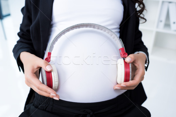 Stockfoto: Zwangere · zakenvrouw · hoofdtelefoon · shot · computer