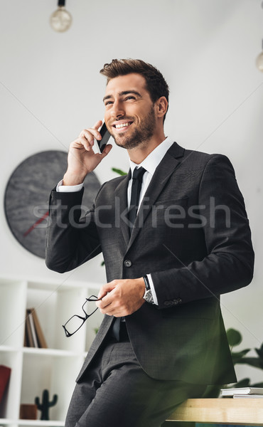 businessman talking by phone Stock photo © LightFieldStudios