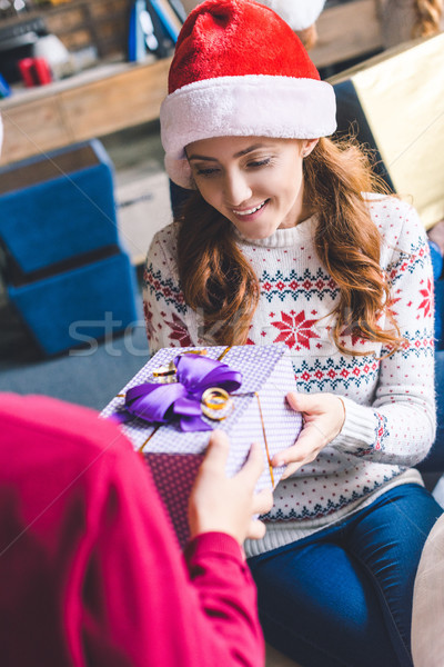 mother taking gift from child Stock photo © LightFieldStudios
