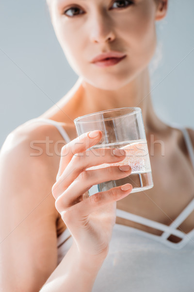 woman holding glass of water Stock photo © LightFieldStudios