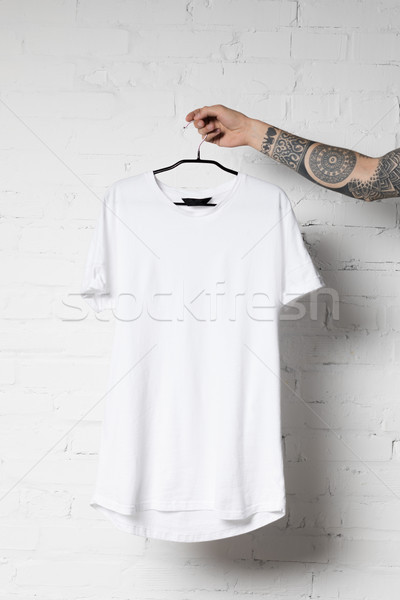 Biały tshirt shot człowiek wieszak Zdjęcia stock © LightFieldStudios