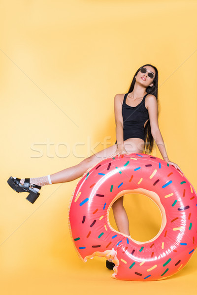 Woman with doughnut pool float Stock photo © LightFieldStudios
