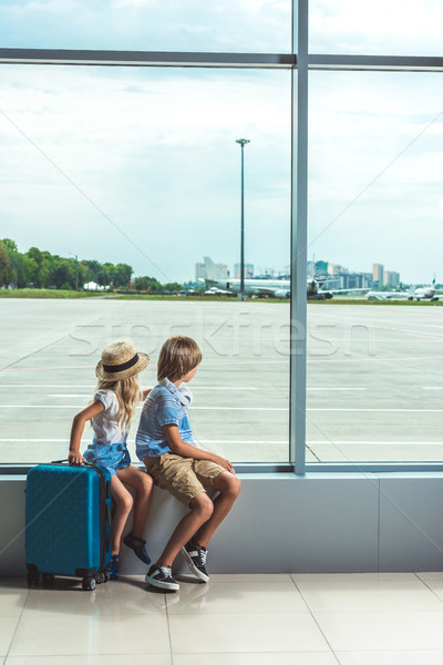 kids looking out window in airport Stock photo © LightFieldStudios