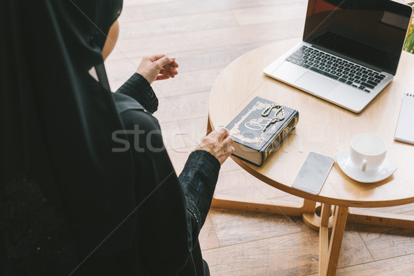 Stock photo: muslim woman with quran book