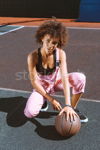 african-american woman with basketball at sports court Stock photo © LightFieldStudios