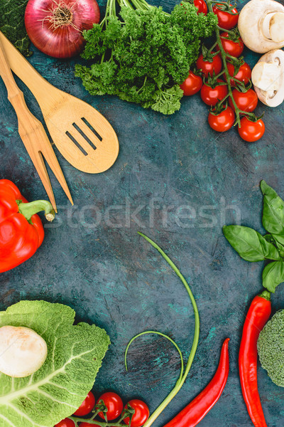 Stock photo: top view of fresh healthy vegetables and wooden utensils on black