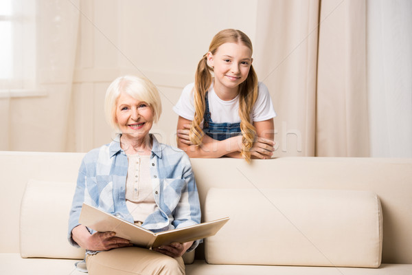 Adorable petite fille supérieurs femme souriant [[stock_photo]] © LightFieldStudios