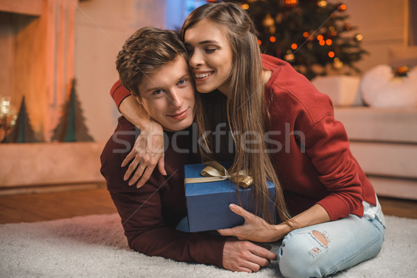happy woman hugging boyfriend on christmas Stock photo © LightFieldStudios