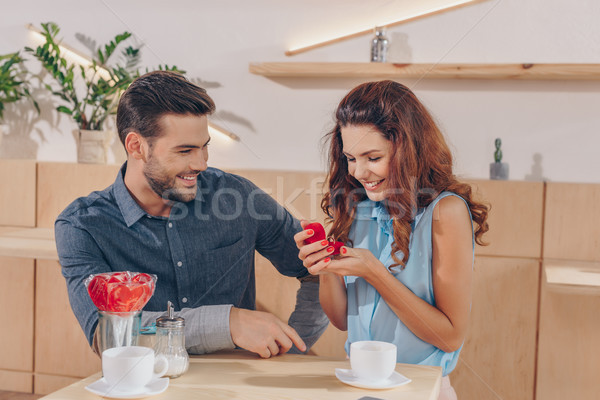 happy woman with engagement ring Stock photo © LightFieldStudios