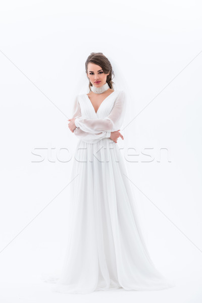 Brunette bruid poseren elegante trouwjurk geïsoleerd Stockfoto © LightFieldStudios