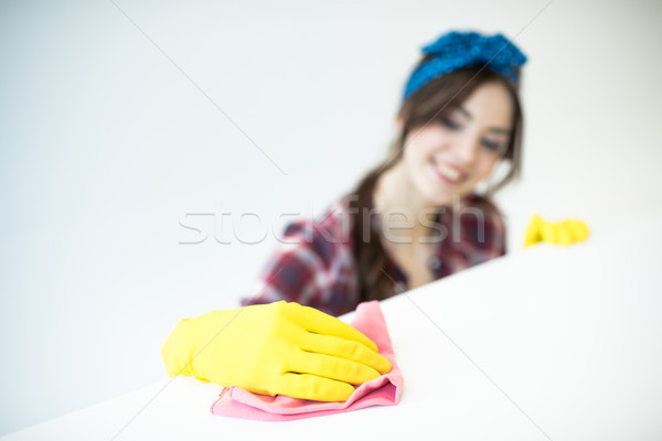 Woman cleaning surface Stock photo © LightFieldStudios