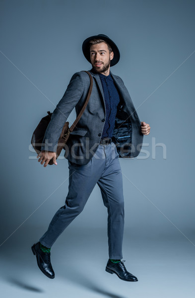 Stock photo: man in suit jumping up