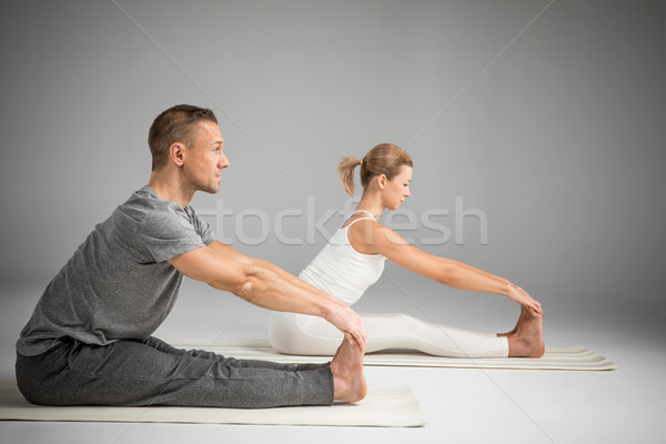 Couple practicing yoga Stock photo © LightFieldStudios