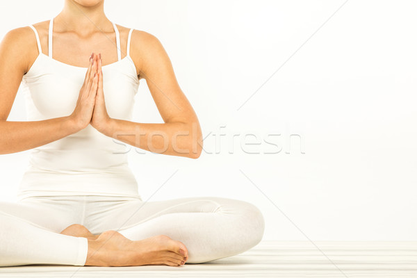 Kobieta posiedzenia Lotos pozycja namaste gest Zdjęcia stock © LightFieldStudios
