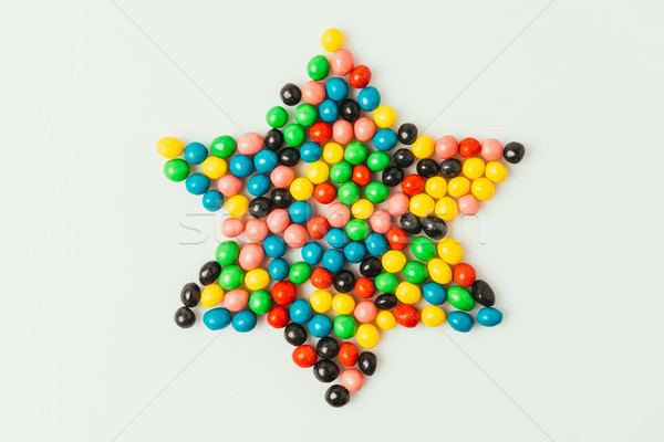 top view of star made of sweets isolated on grey, purim holiday concept Stock photo © LightFieldStudios